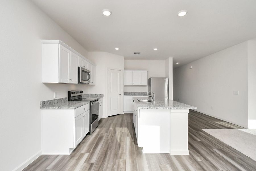 Furnished interior view inside a new home in Sunterra, Katy (Image 14).