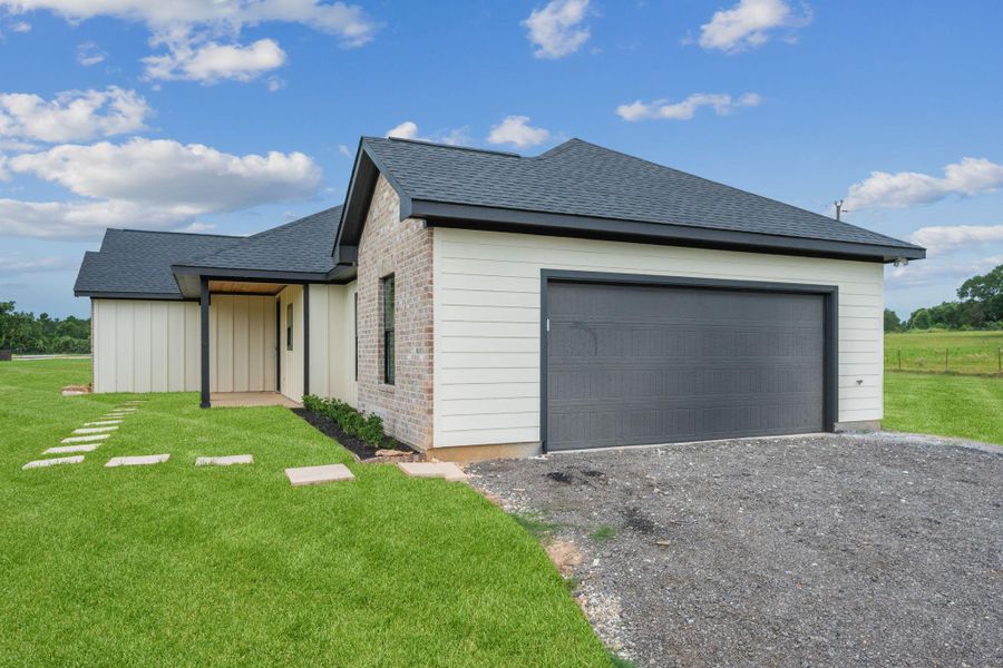 Front exterior of a new home in , Franklin, TX, highlighting curb appeal (Image 2).