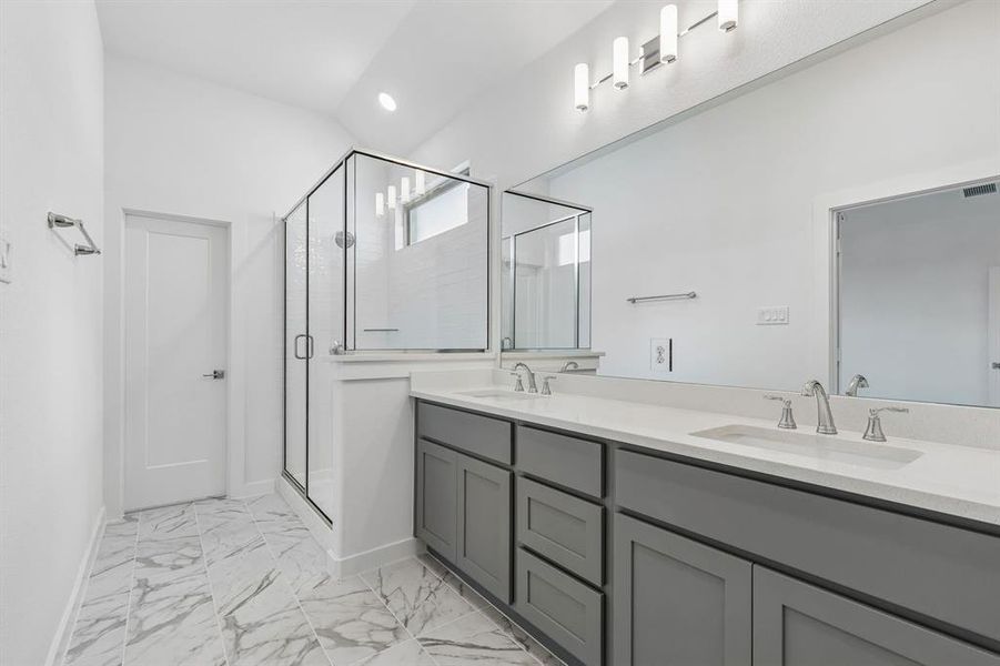 Primary Bathroom in the Claret home plan by Trophy Signature Homes – REPRESENTATIVE PHOTO