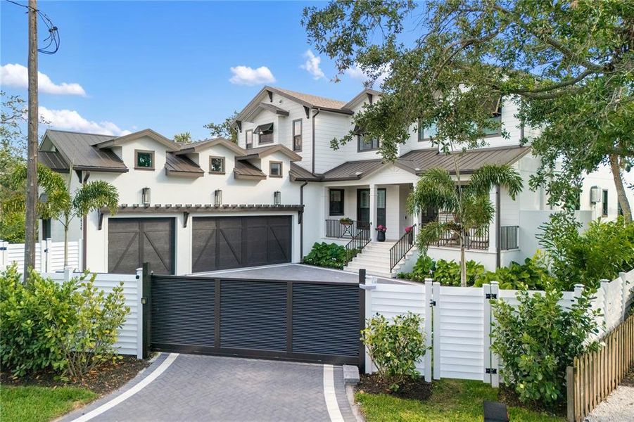 Front exterior of a new home in , Sarasota, FL, highlighting curb appeal (Image 24). Front exterior of a new home in , Sarasota, FL, highlighting curb appeal (Image 24).
