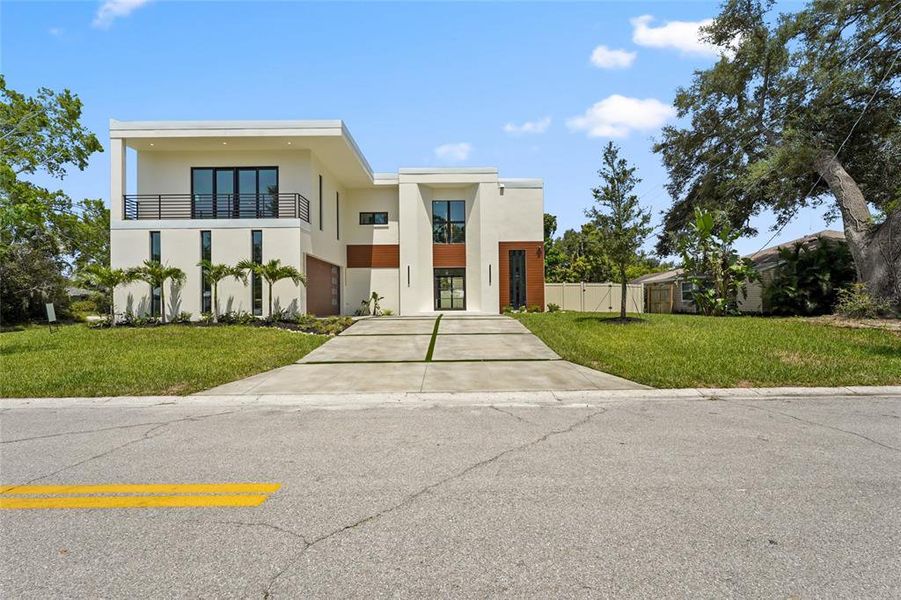 Front exterior of a new home in , Sarasota, FL, highlighting curb appeal (Image 29).