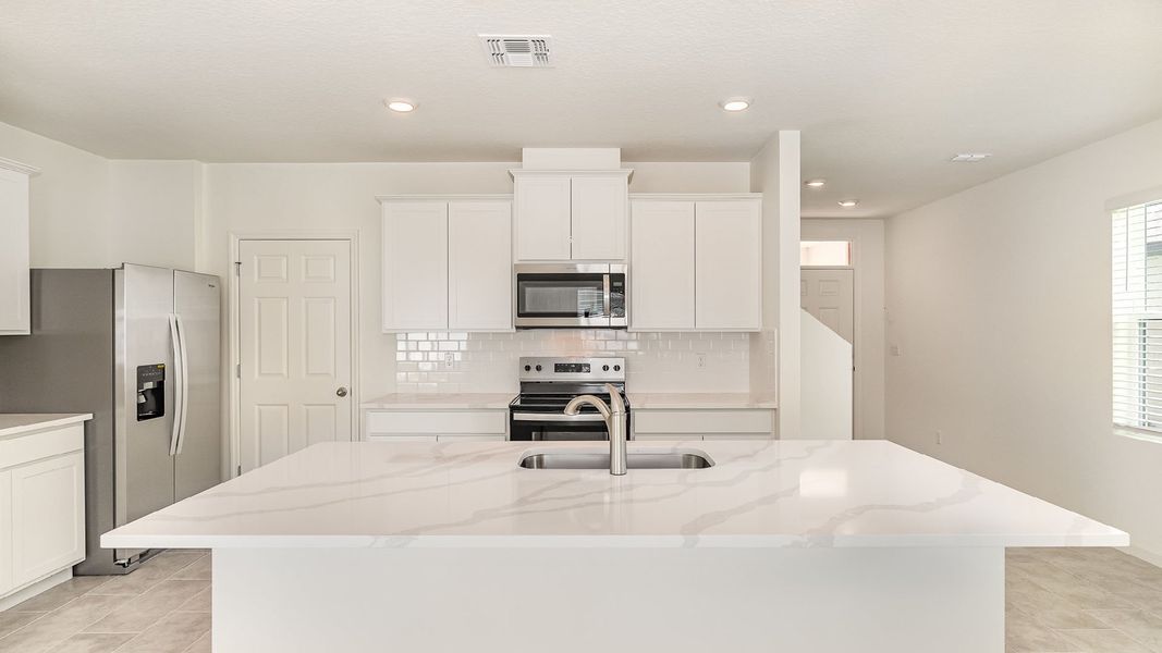Representative furnished interior of a home built from the Hayden by D.R. Horton in Morningside, Fort Pierce (Image 4).