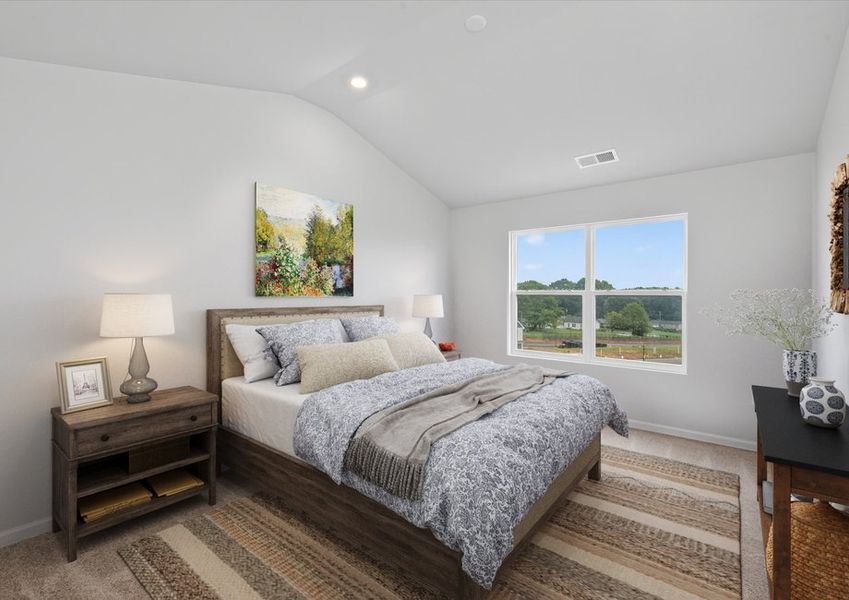 The master bedroom has tall ceilings and windows