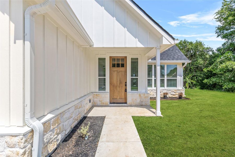 Front exterior of a new home in , Brenham, TX, highlighting curb appeal (Image 1). Front exterior of a new home in , Brenham, TX, highlighting curb appeal (Image 1).