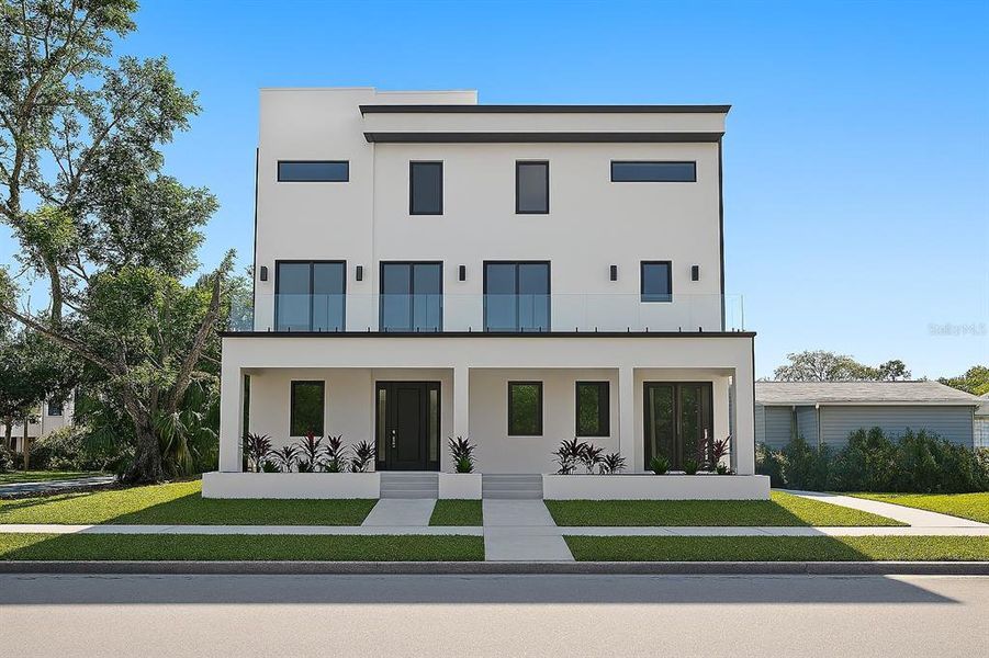Front exterior of a new home in , Tampa, FL, highlighting curb appeal (Image 2). Front exterior of a new home in , Tampa, FL, highlighting curb appeal (Image 2).
