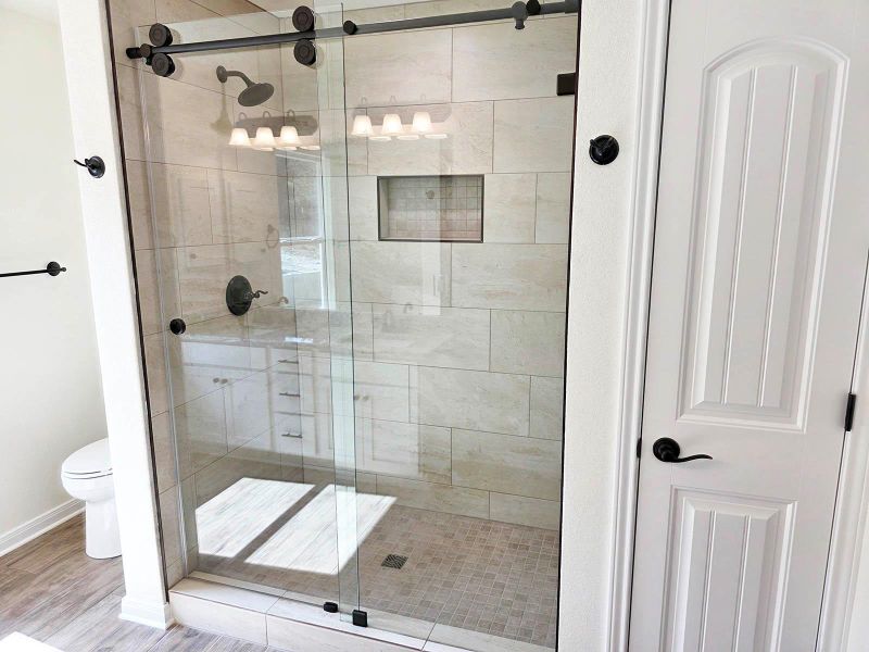 Full bathroom with a stall shower and wood finished floors