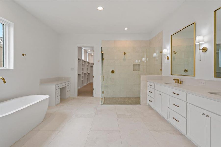 Attached to the master bedroom is the stunning master bath complete with a huge shower, soaking tub, incredible storage and separate vanity space.