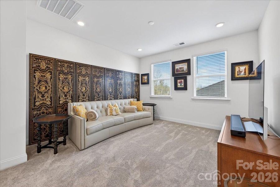 Large loft/flex space on the upstairs level with 2 windows.