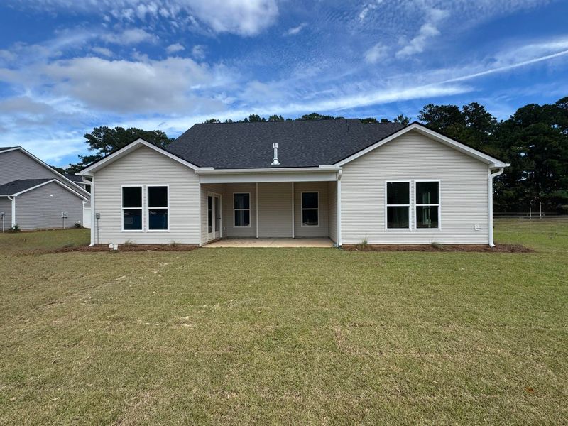 Front exterior of a new home in Central Estates, Summerville, SC, highlighting curb appeal (Image 22).