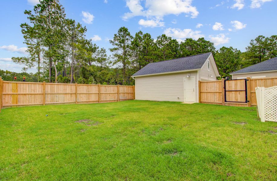 Front exterior of a new home in Limehouse Village: Row Collection, Summerville, SC, highlighting curb appeal (Image 22).