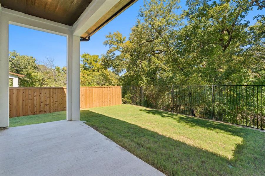 Fenced backyard and greenbelt views. Fenced backyard and greenbelt views.