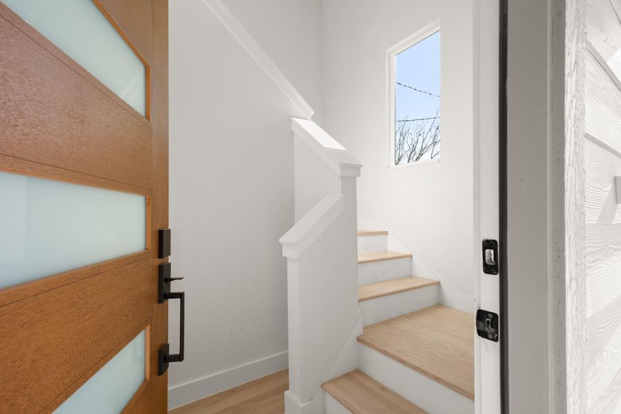 Stairs featuring baseboards and wood finished floors