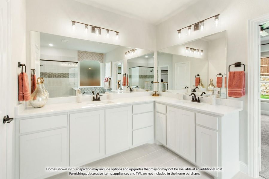 Master bathroom with L-shaped double vanity, white cabinets, dual mirrors, and a walk-in shower visible in background. Master bathroom with L-shaped double vanity, white cabinets, dual mirrors, and a walk-in shower visible in background.