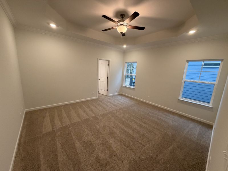 Stock Photo: Primary Bedroom (4 of 4) with a Trey Ceiling & extra lighting
