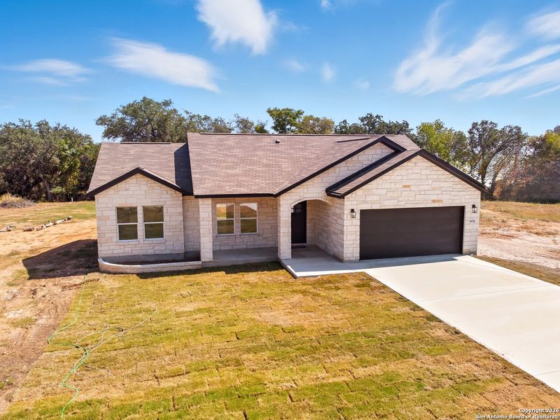 Front exterior of a new home in , Atascosa, TX, highlighting curb appeal (Image 18).