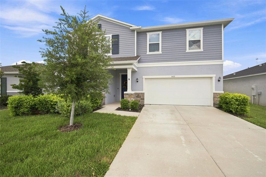 Front exterior of a new home in , Land O' Lakes, FL, highlighting curb appeal (Image 22).