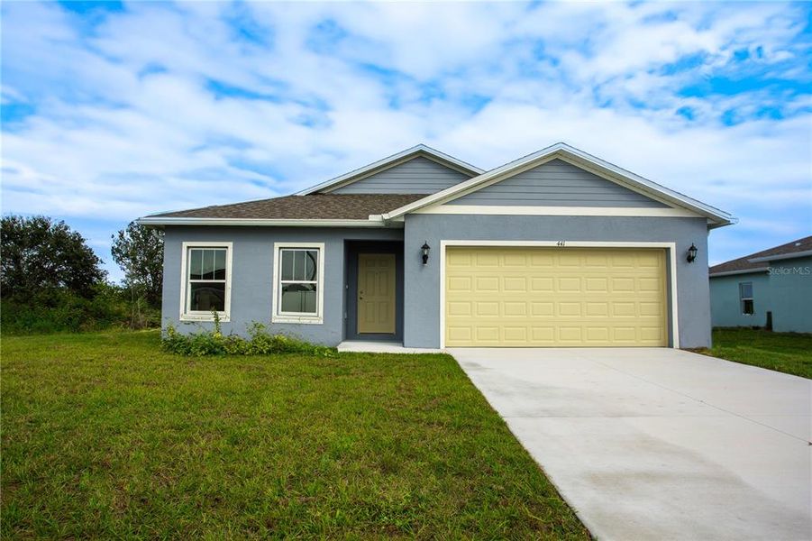 Front exterior of a new home in , Lehigh Acres, FL, highlighting curb appeal (Image 2). Front exterior of a new home in , Lehigh Acres, FL, highlighting curb appeal (Image 2).