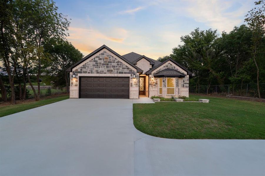 Front exterior of a new home in , Gainesville, TX, highlighting curb appeal (Image 22). Front exterior of a new home in , Gainesville, TX, highlighting curb appeal (Image 22).