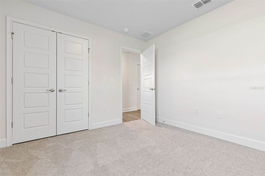 Representative unfurnished interior of a home built from the 2265 by Adams Homes in Royal Highlands, Spring Hill (Image 37).