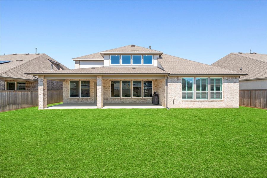 Exterior details and patio area of a home in Bridgeland, Cypress (Image 27).