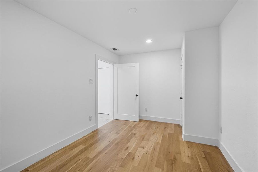 Unfurnished room with light wood-style flooring and recessed lighting