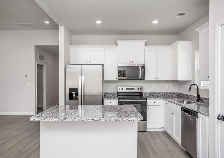 The master bedroom has an en-suite bathroom