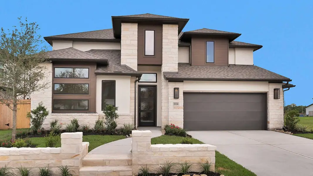 Front exterior of a new home in Sienna, Missouri City, TX, highlighting curb appeal (Image 1). Front exterior of a new home in Sienna, Missouri City, TX, highlighting curb appeal (Image 1).