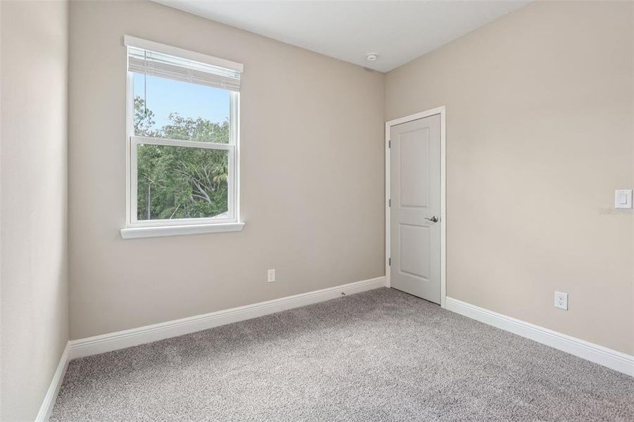 Spacious, unfurnished interior of a new home in Legends Preserve - Signature Series, Daytona Beach (Image 41).