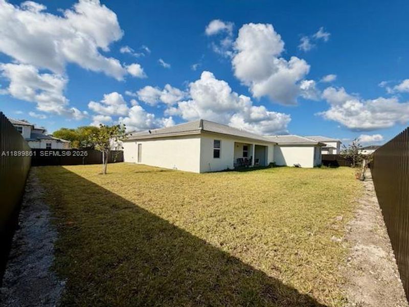 Exterior details and patio area of a home in Hawthorne at Galiano Pointe, Miami (Image 13).
