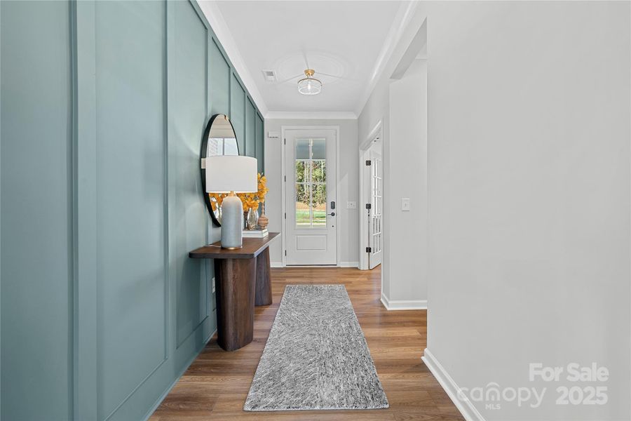 Front Foyer featuring accent wall and premium design.