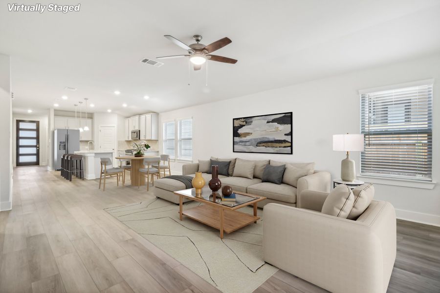 Virtually staged living room in the Hughes floorplan at a Meritage Homes community.