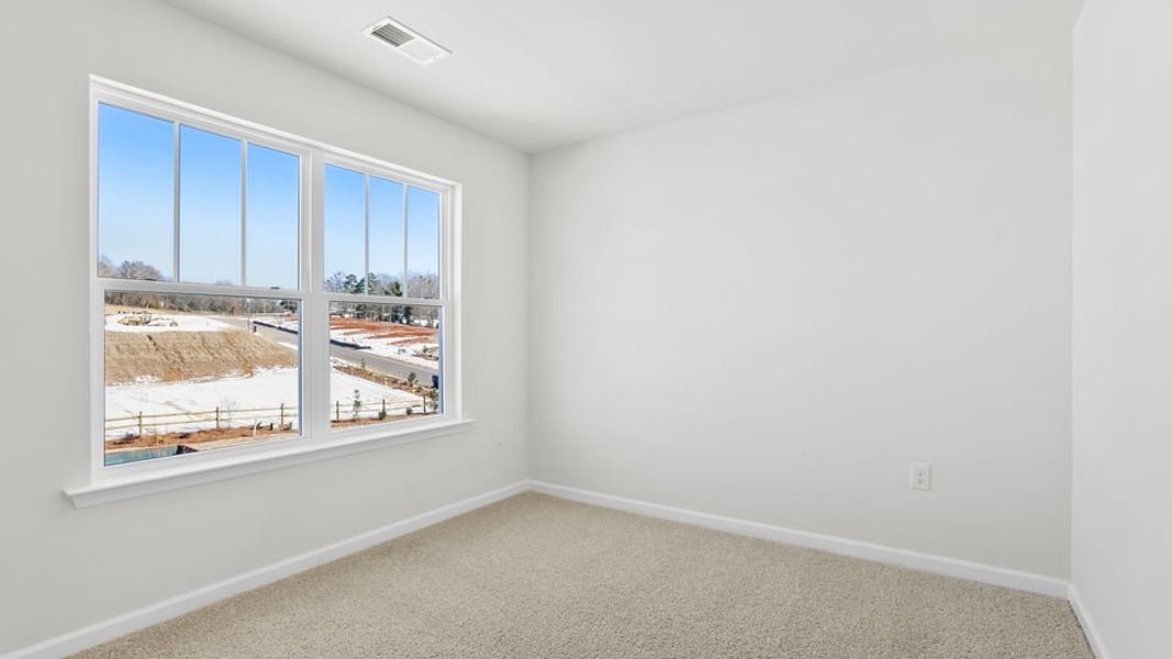 Spacious, unfurnished interior of a new home in Village Grove, Greenville (Image 27).