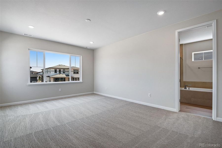 Spacious, unfurnished interior of a new home in Ensemble at The Aurora Highlands, Aurora (Image 21).