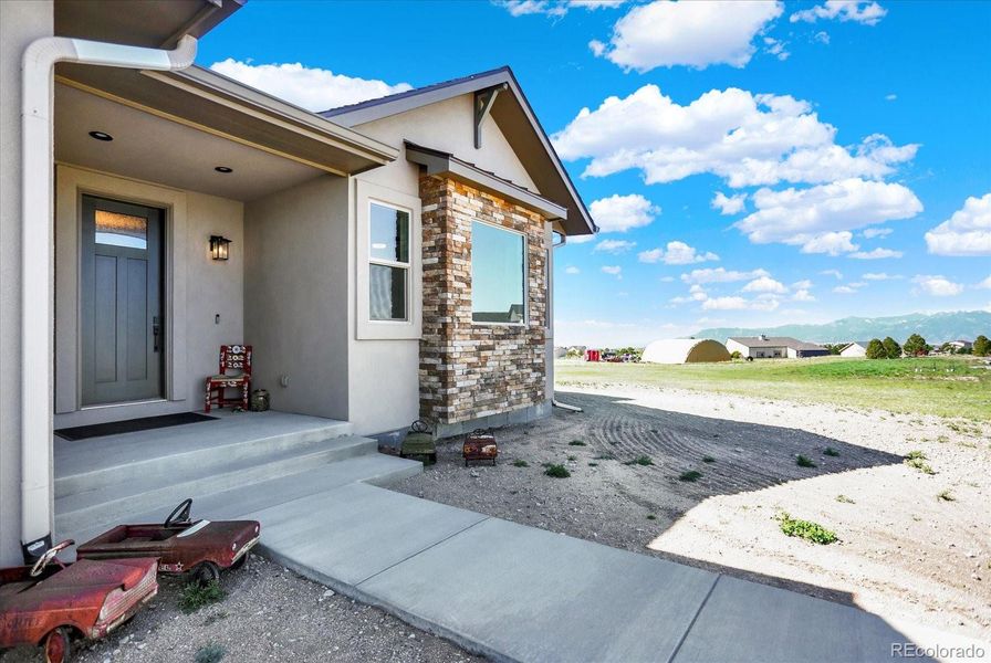 Front exterior of a new home in , Colorado Springs, CO, highlighting curb appeal (Image 28).