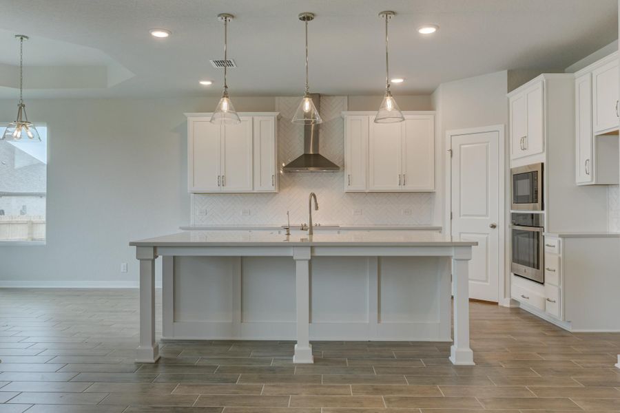 Representative furnished interior of a home built from the Guadalupe by Ashton Woods in The Heritage at Saddlebrook Ranch 70's, Schertz (Image 6).