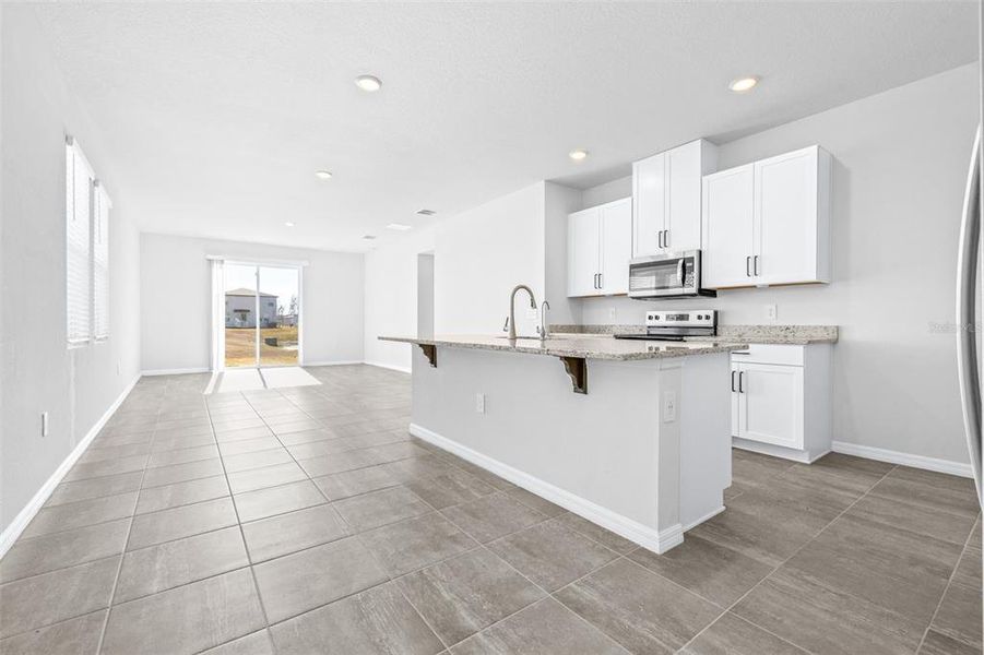 Furnished interior view inside a new home in The Grove at Stuart Crossing - Premier Series, Bartow (Image 6).