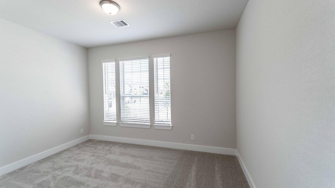 Spacious, unfurnished interior of a new home in Sunterra, Katy (Image 7).