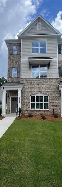 Front exterior of a new home in Townes at South Main, Kennesaw, GA, highlighting curb appeal (Image 2). Front exterior of a new home in Townes at South Main, Kennesaw, GA, highlighting curb appeal (Image 2).