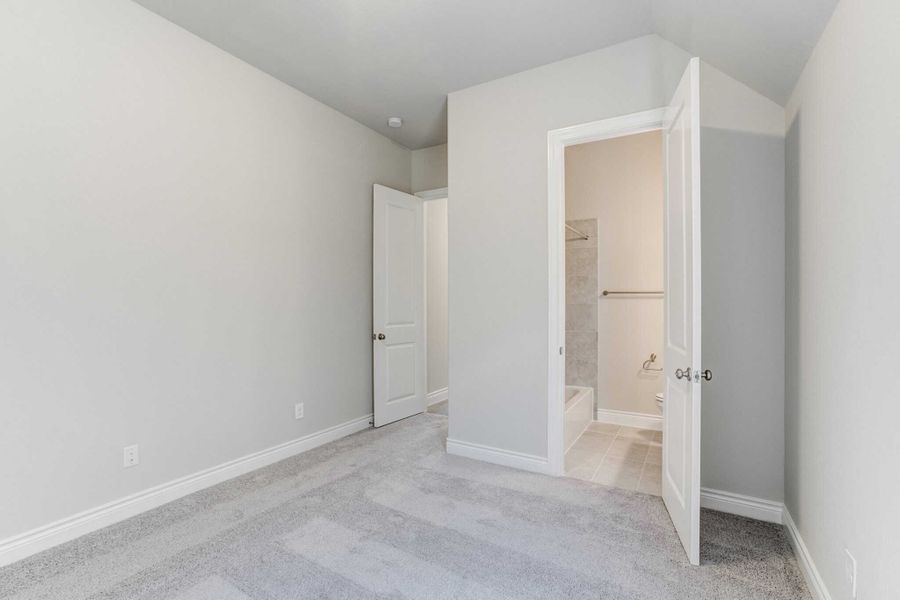 Representative unfurnished interior of a home built from the 2688 by Ravenna Homes in The Woodlands Hills 65′, Willis (Image 32).
