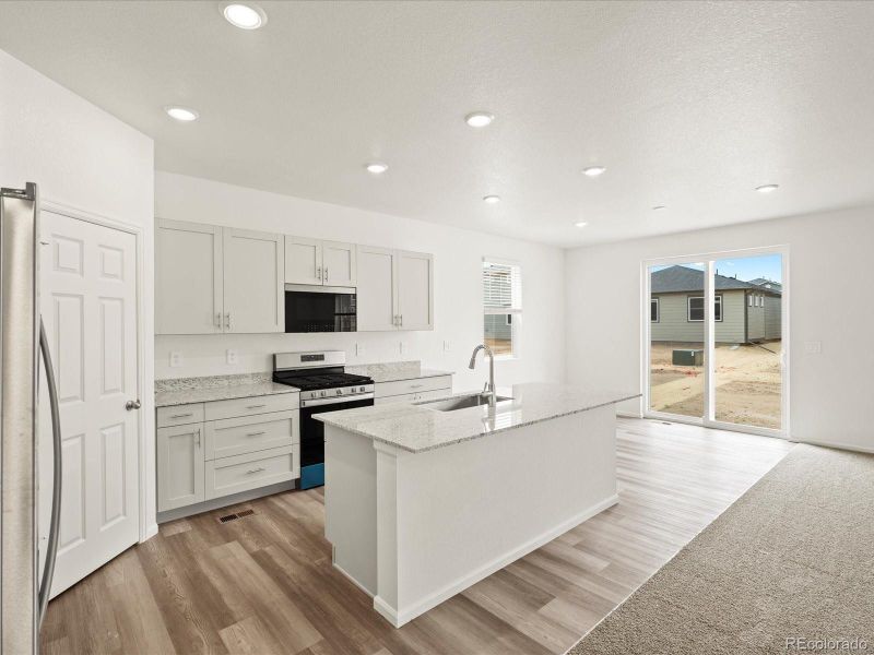 Furnished interior view inside a new home in Ridgeline Vista: The Flora Collection, Brighton (Image 13).