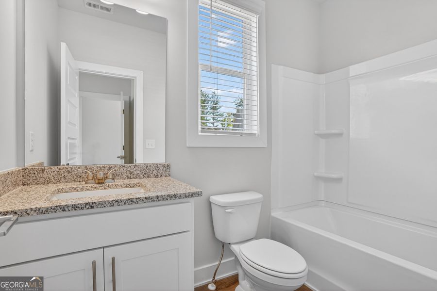 Furnished interior view inside a new home in The Fairways at Mirror Lake, Villa Rica (Image 9).