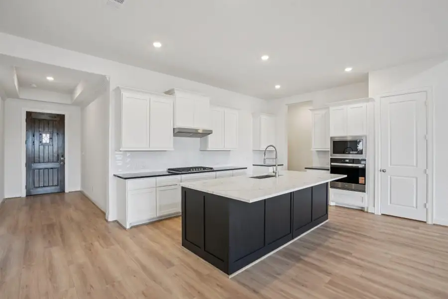 Furnished interior view inside a new home in Del Bello Lakes 60', Manvel (Image 7).