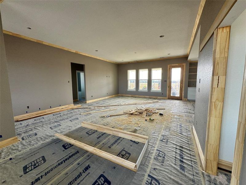 Carpeted empty room with ornamental molding