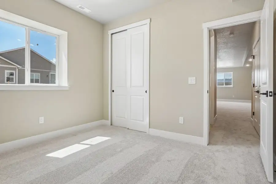 Spacious, unfurnished interior of a new home in Jackson Creek North, Monument (Image 52).