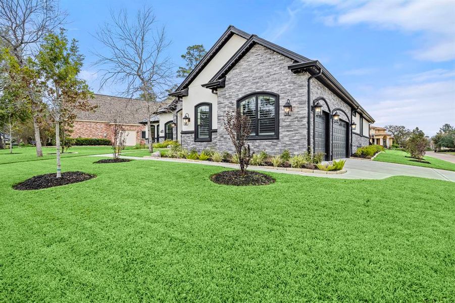 Three car garage on corner lot and cul de sac street. Garage is drywalled, painted with epoxy floors and includes dog wash and EV charging station. Attic space above garage is decked for storage