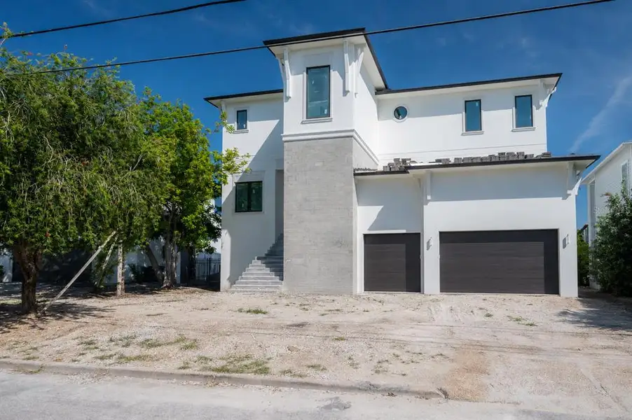 Front exterior of a new home in , Tampa, FL, highlighting curb appeal (Image 1). Front exterior of a new home in , Tampa, FL, highlighting curb appeal (Image 1).