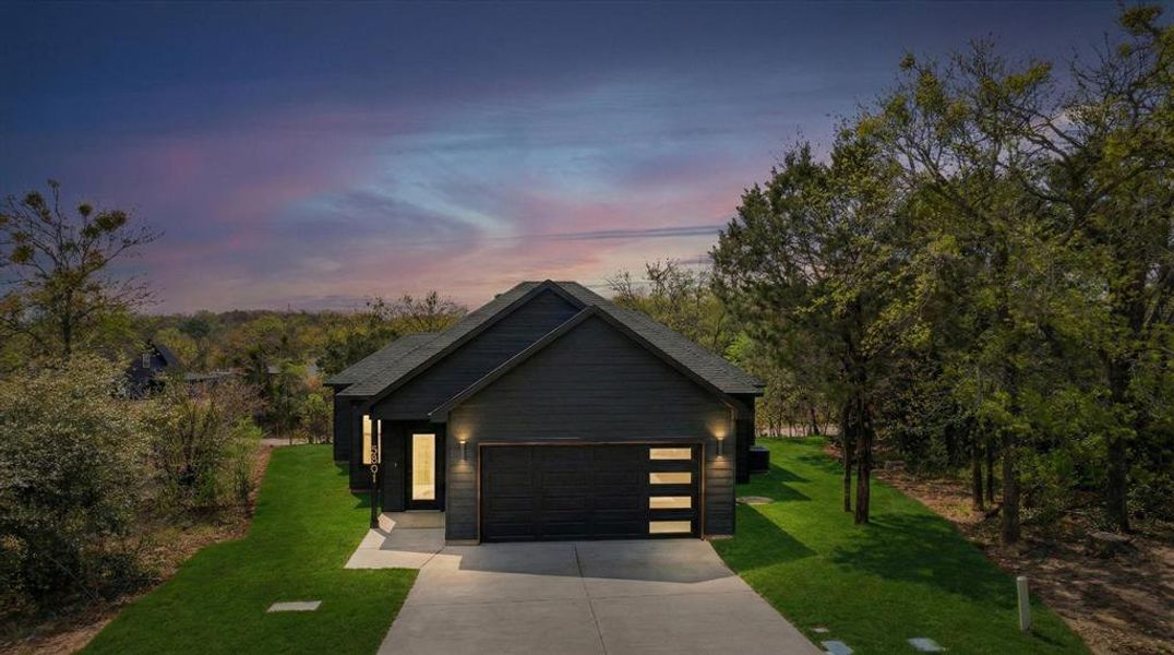 Front exterior of a new home in , Granbury, TX, highlighting curb appeal (Image 1). Front exterior of a new home in , Granbury, TX, highlighting curb appeal (Image 1).