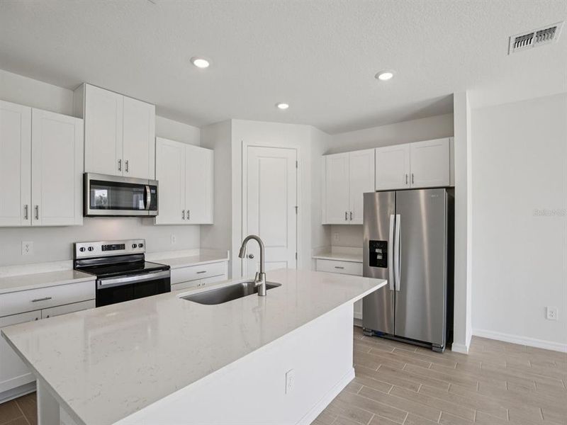 Furnished interior view inside a new home in Coasterra - Reserve Series, Palmetto (Image 9).