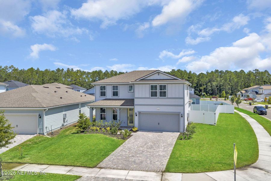 Front exterior of a new home in Double Branch, Middleburg, FL, highlighting curb appeal (Image 32). Front exterior of a new home in Double Branch, Middleburg, FL, highlighting curb appeal (Image 32).