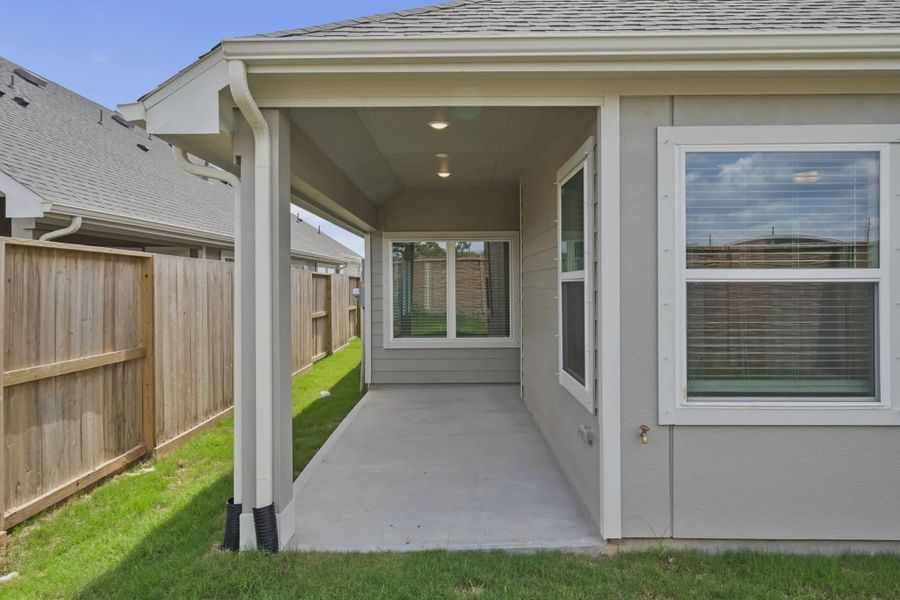 Representative exterior details of a home built from the Carriagehouse by Chesmar Homes in Meridiana Townhomes, Iowa Colony (Image 3).